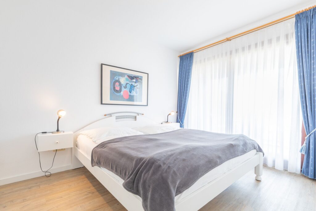 Schlafzimmer in Ferienwohnung Wenningstedt
