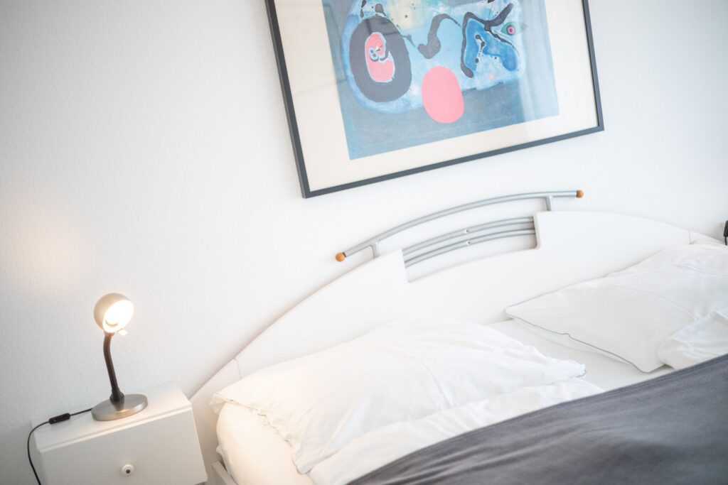 Schlafzimmer in Ferienwohnung Wenningstedt