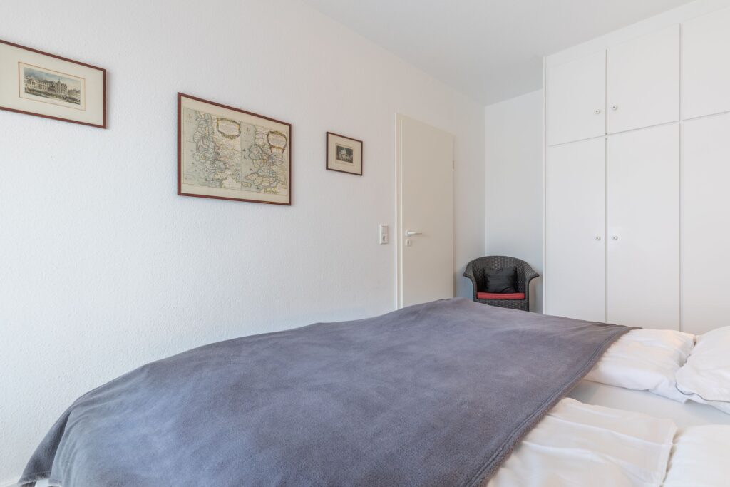 Schlafzimmer in Ferienwohnung Wenningstedt