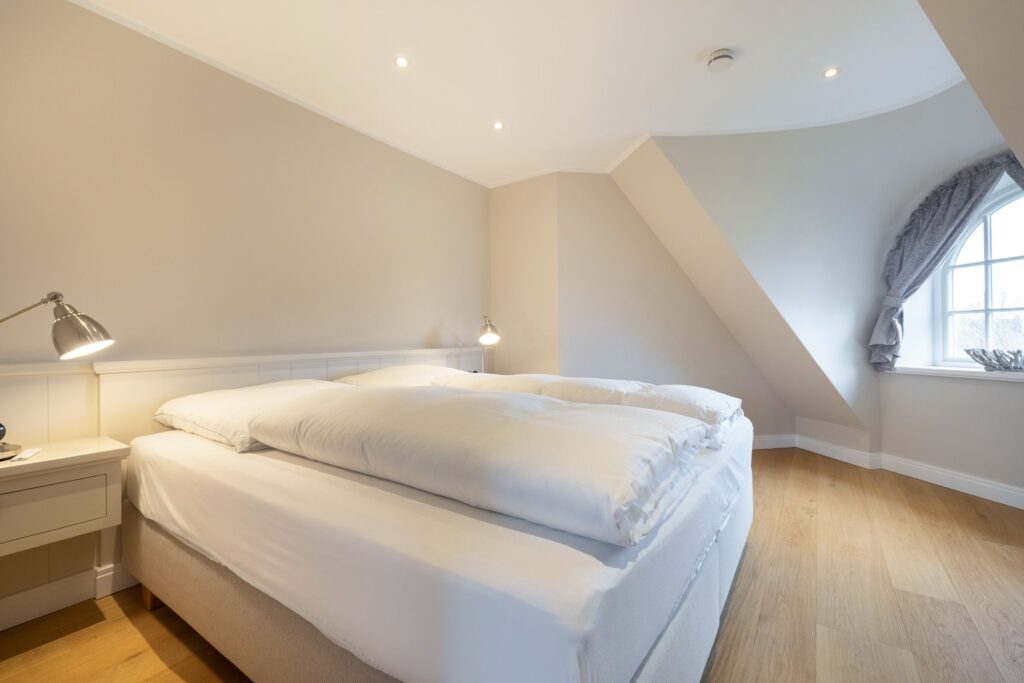 Schlafzimmer in Ferienwohnung Wenningstedt