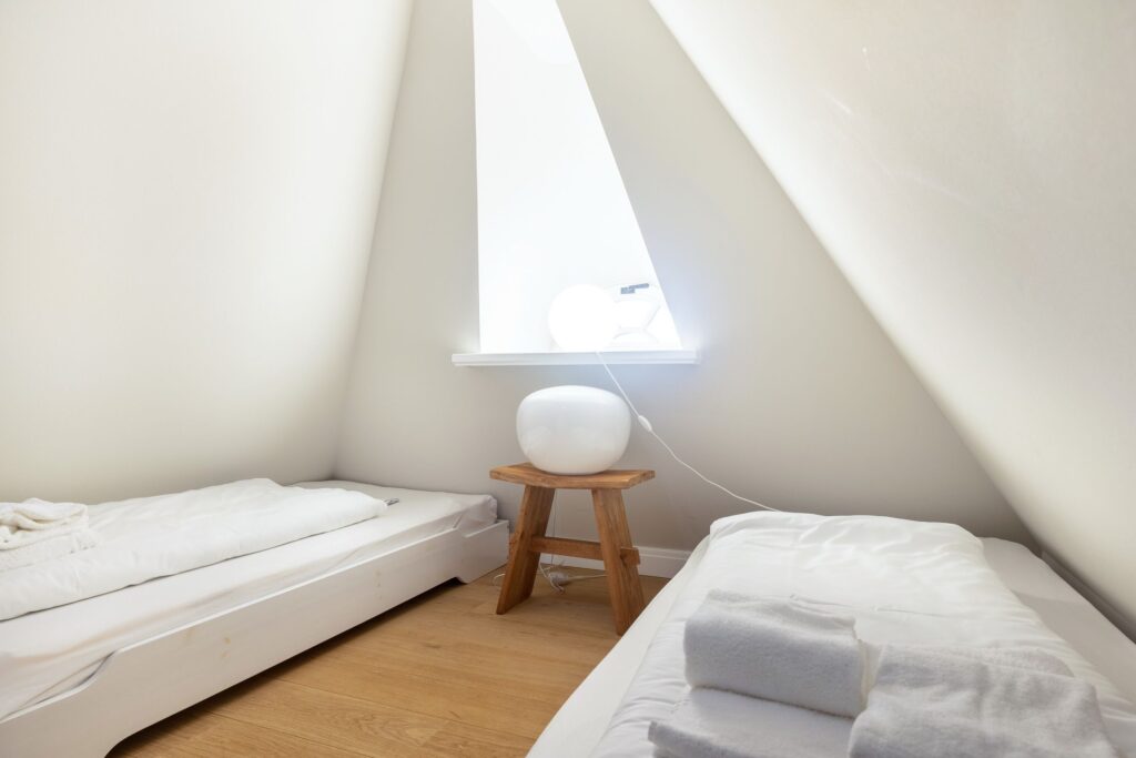 Schlafzimmer in Ferienwohnung Wenningstedt