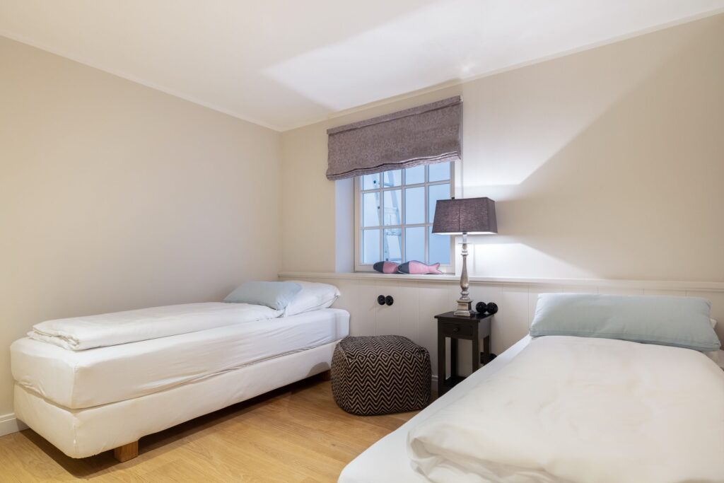 Schlafzimmer in Ferienwohnung Wenningstedt