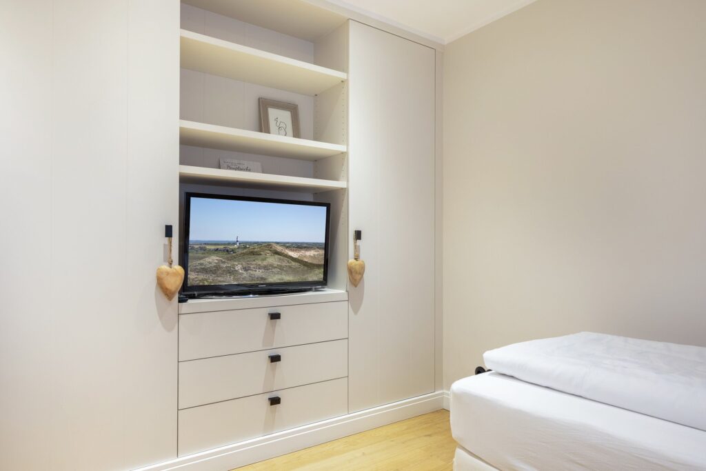 Schlafzimmer in Ferienwohnung Wenningstedt