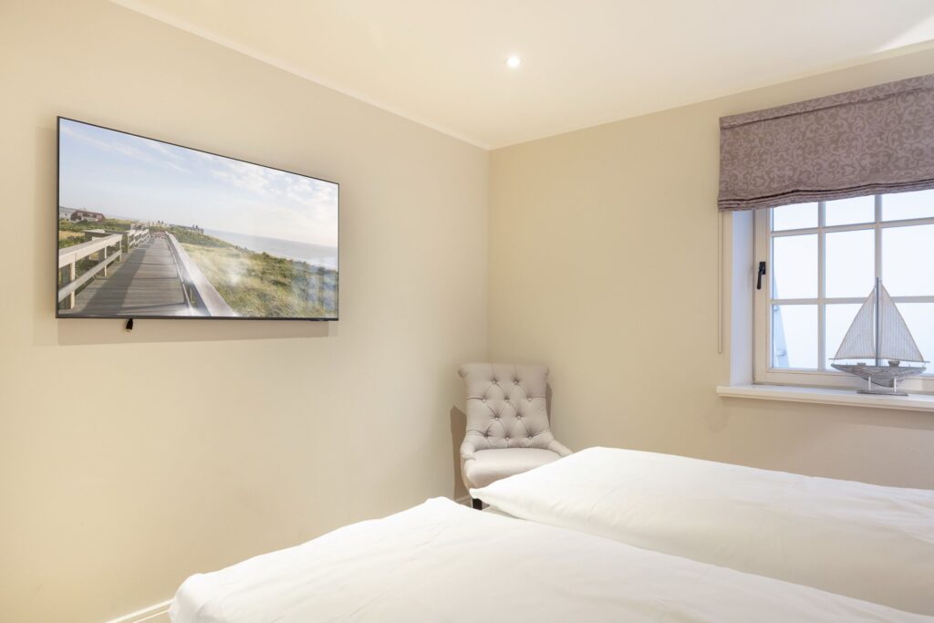 Schlafzimmer in Ferienwohnung Wenningstedt