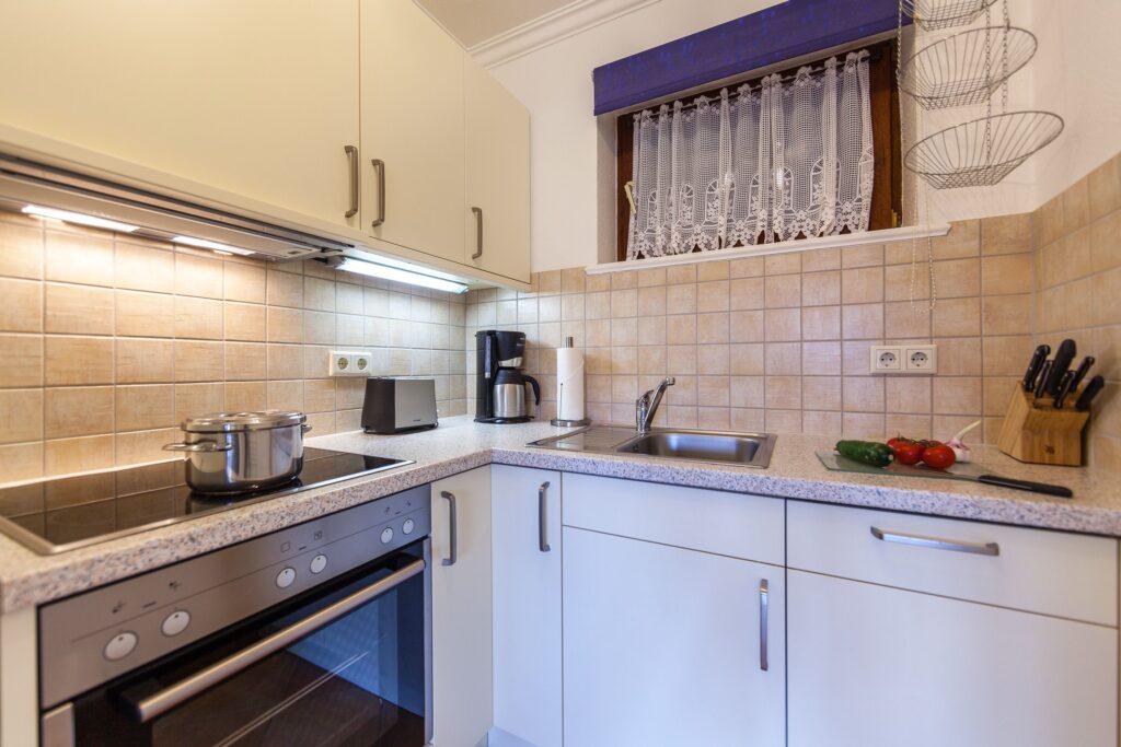 Küche in Ferienwohnung Wenningstedt