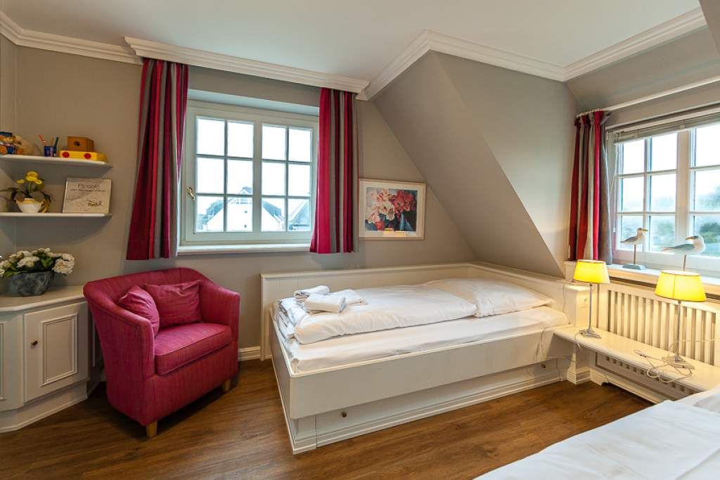 Schlafzimmer in Ferienwohnung Wenningstedt
