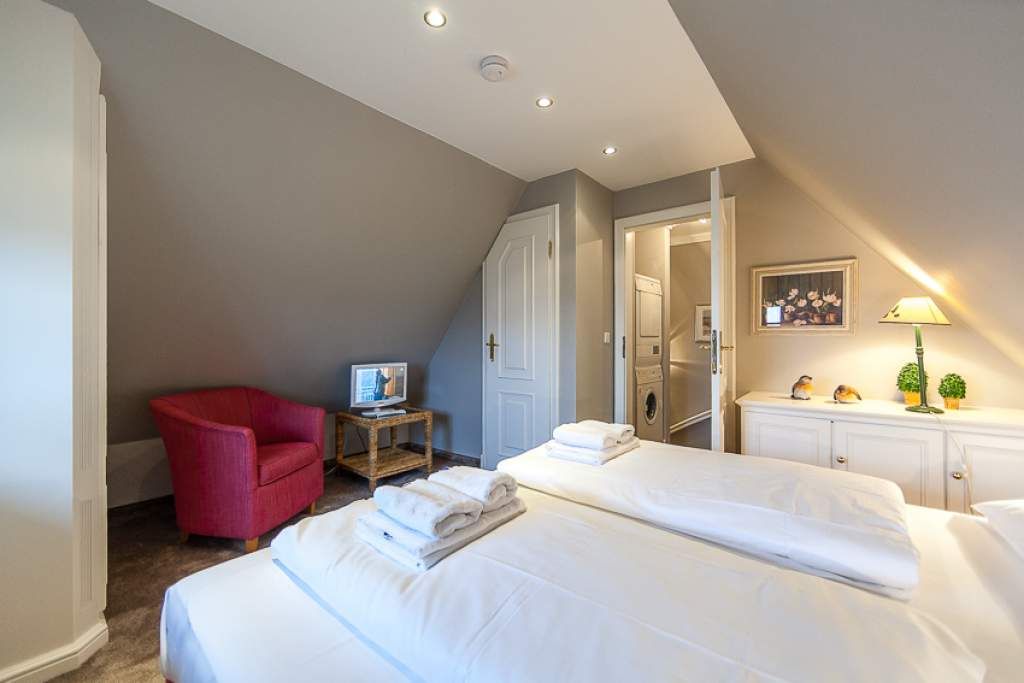 Schlafzimmer in Ferienwohnung Wenningstedt