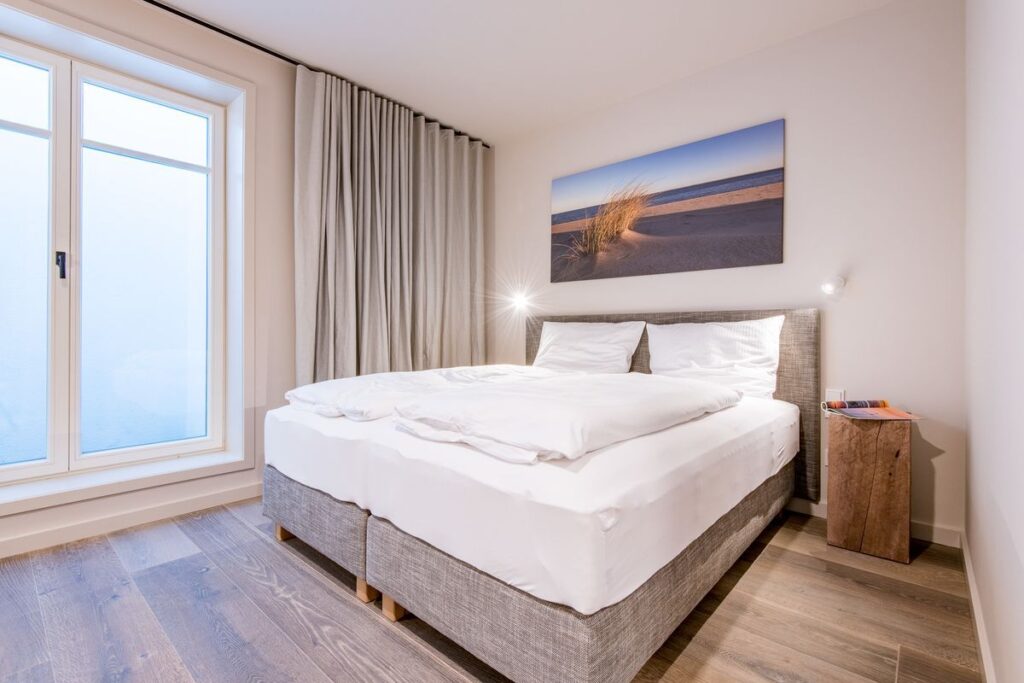 Schlafzimmer in Ferienwohnung Wenningstedt
