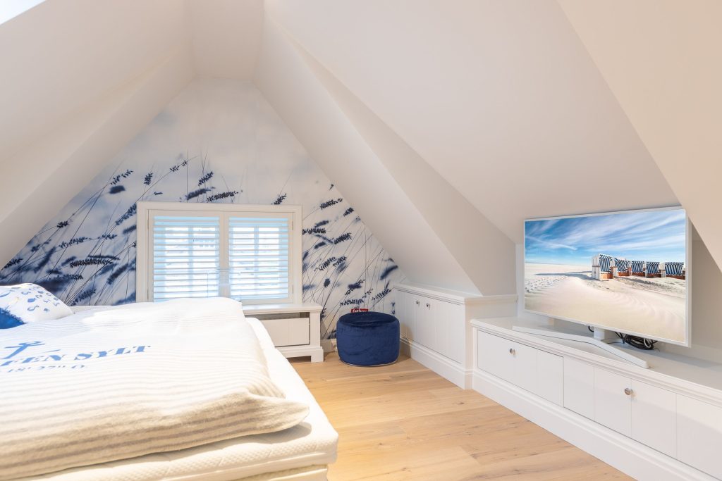 Schlafzimmer in Ferienwohnung Wenningstedt