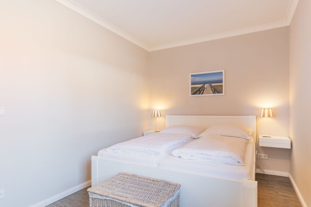Schlafzimmer in Ferienwohnung Wenningstedt