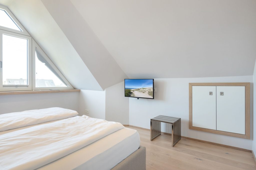 Schlafzimmer in Ferienwohnung Wenningstedt
