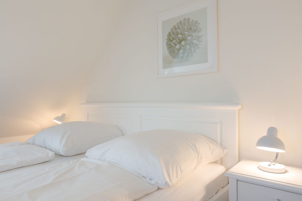 Schlafzimmer in Ferienwohnung Wenningstedt