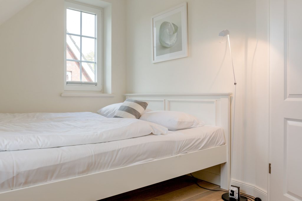 Schlafzimmer in Ferienwohnung Wenningstedt