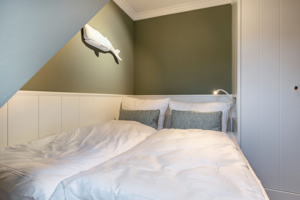 Schlafzimmer in Ferienwohnung Wenningstedt