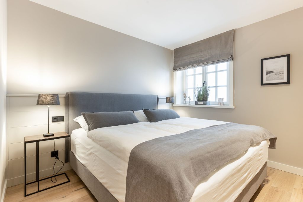 Schlafzimmer in Ferienwohnung Wenningstedt