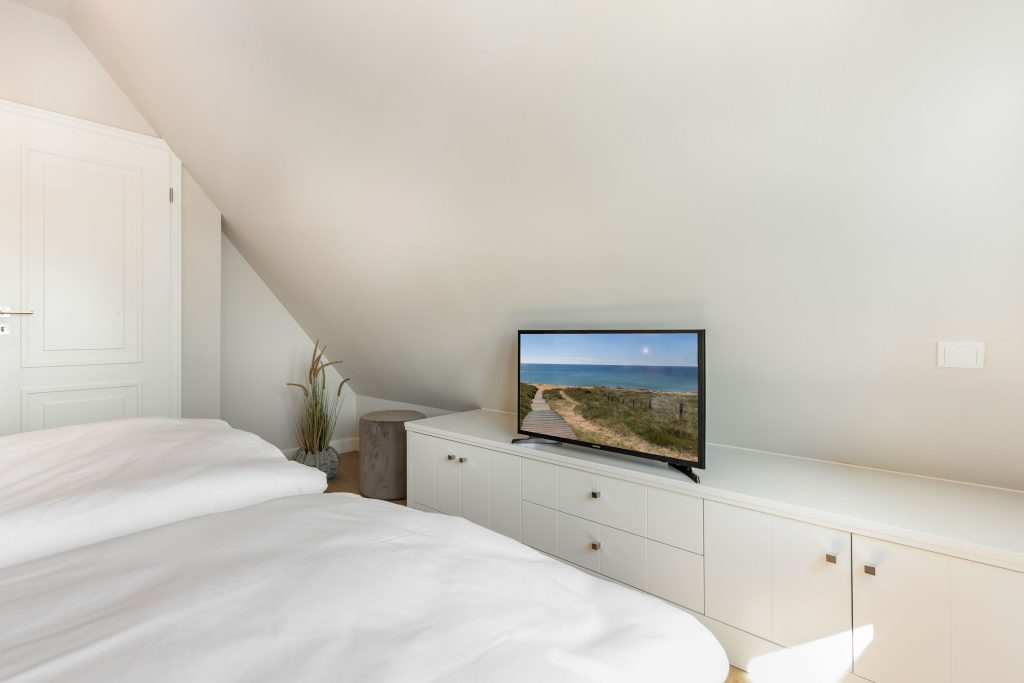 Schlafzimmer in Ferienwohnung Wenningstedt