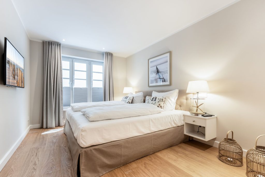 Schlafzimmer in Ferienwohnung Wenningstedt