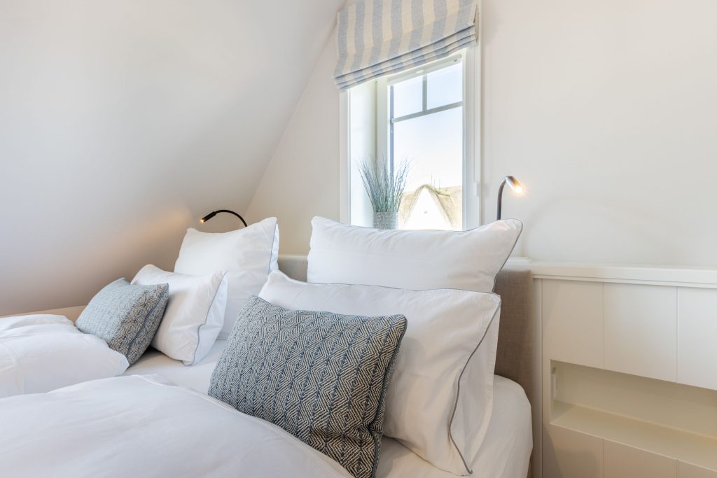 Schlafzimmer in Ferienwohnung Wenningstedt