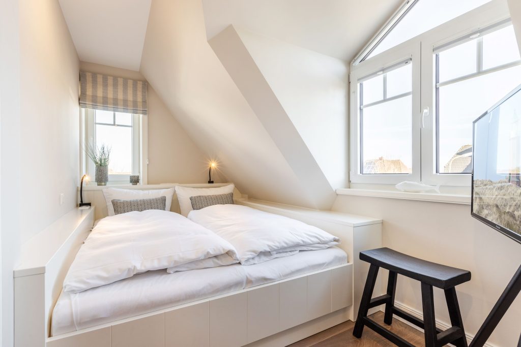 Schlafzimmer in Ferienwohnung Wenningstedt