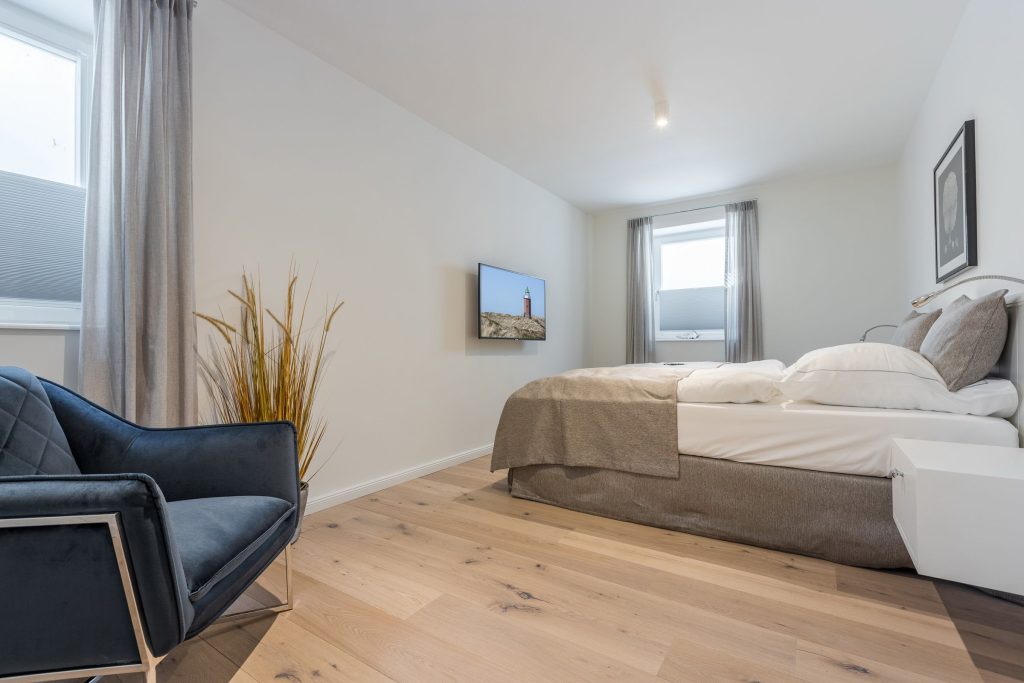 Schlafzimmer in Ferienwohnung Wenningstedt