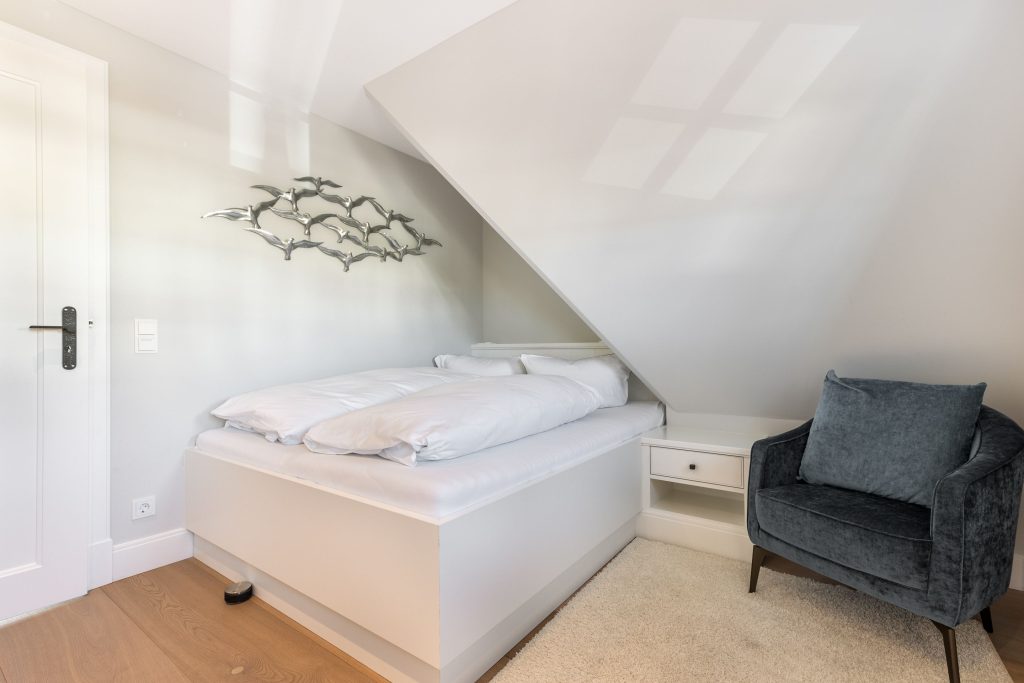 Schlafzimmer in Ferienwohnung Wenningstedt
