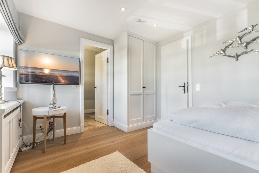 Schlafzimmer in Ferienwohnung Wenningstedt