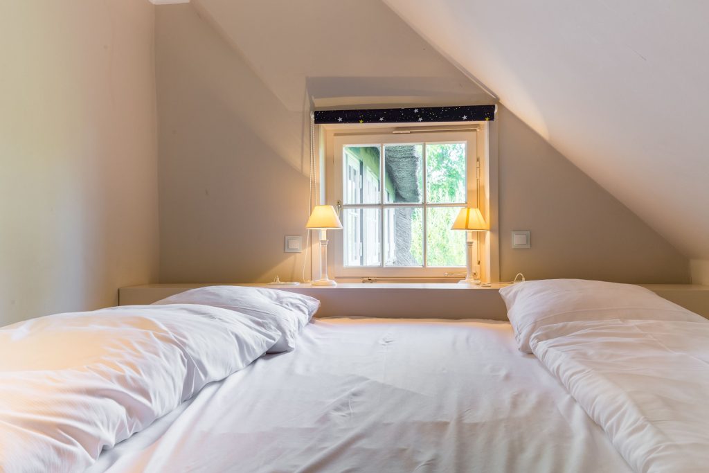 Schlafzimmer in Ferienwohnung Wenningstedt