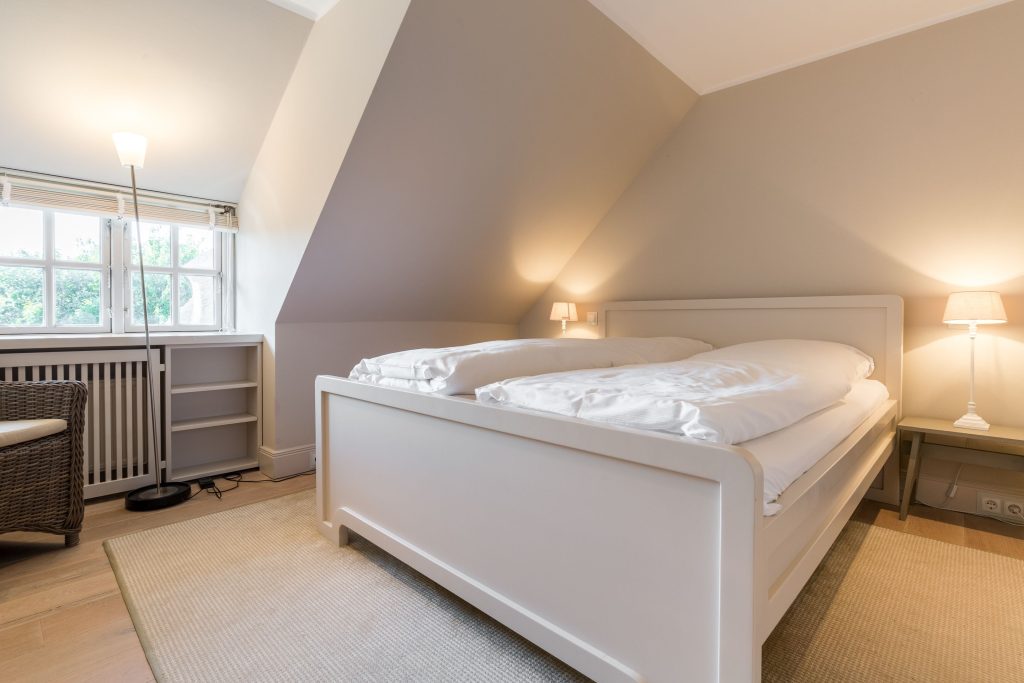 Schlafzimmer in Ferienwohnung Wenningstedt