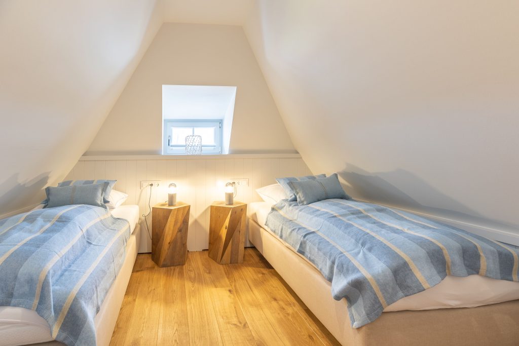 Schlafzimmer in Ferienwohnung Wenningstedt