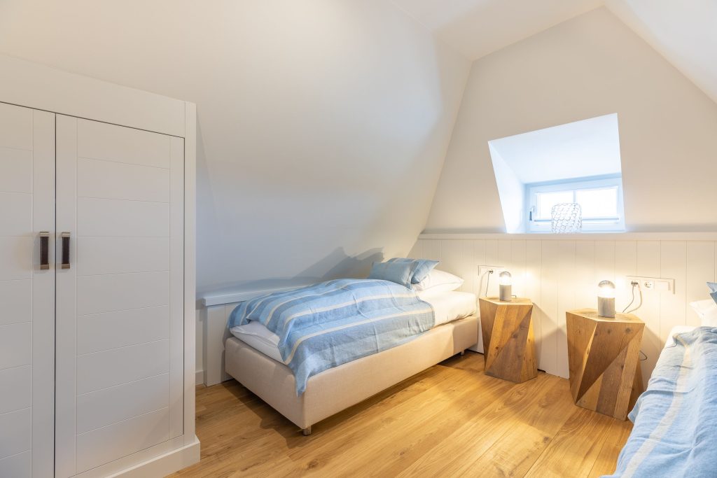 Schlafzimmer in Ferienwohnung Wenningstedt