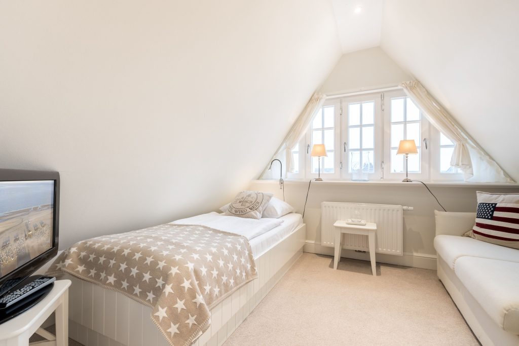 Schlafzimmer in Ferienwohnung Wenningstedt