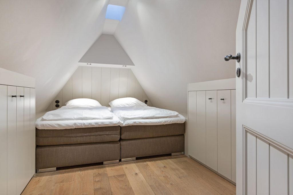 Schlafzimmer in Ferienwohnung Wenningstedt