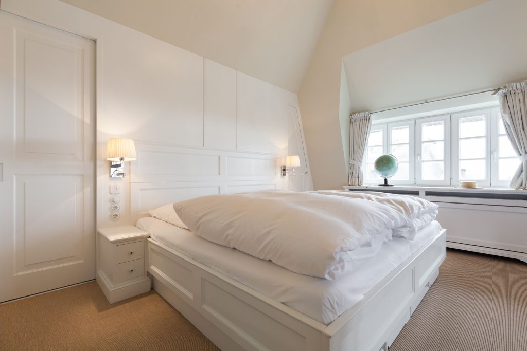 Schlafzimmer in Ferienwohnung Wenningstedt