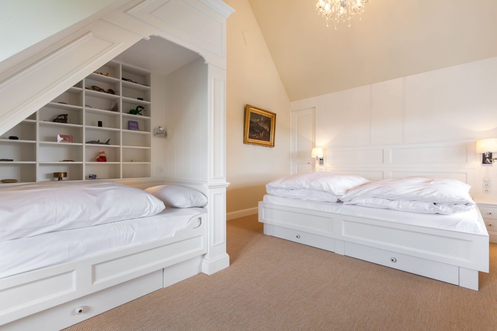 Schlafzimmer in Ferienwohnung Wenningstedt