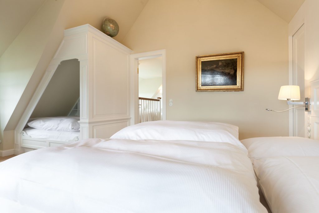 Schlafzimmer in Ferienwohnung Wenningstedt