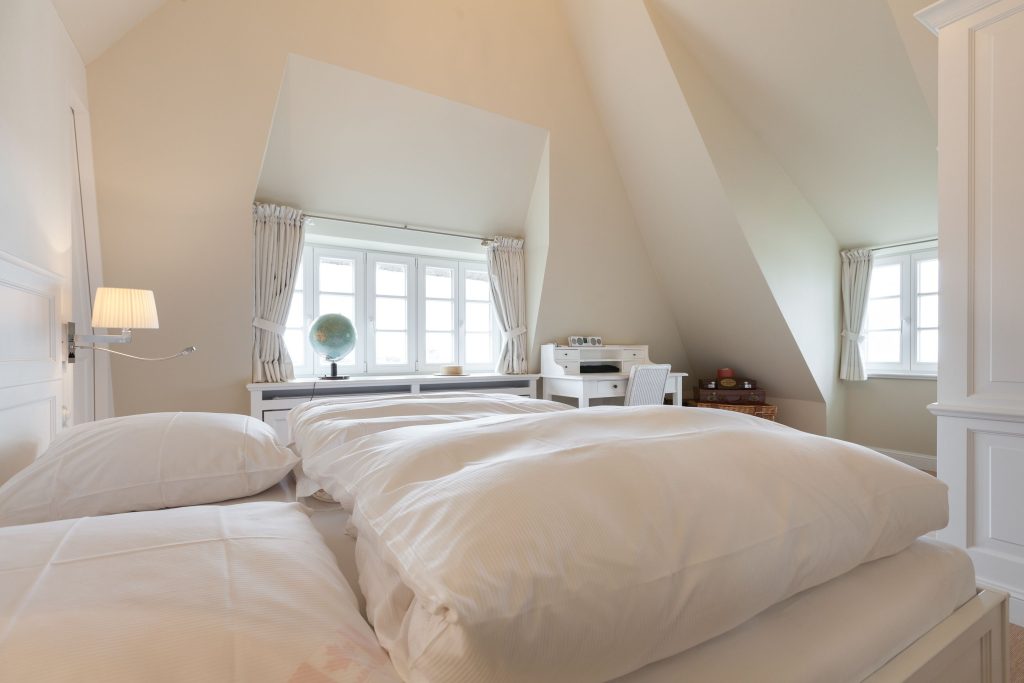 Schlafzimmer in Ferienwohnung Wenningstedt