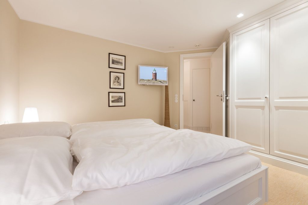 Schlafzimmer in Ferienwohnung Wenningstedt