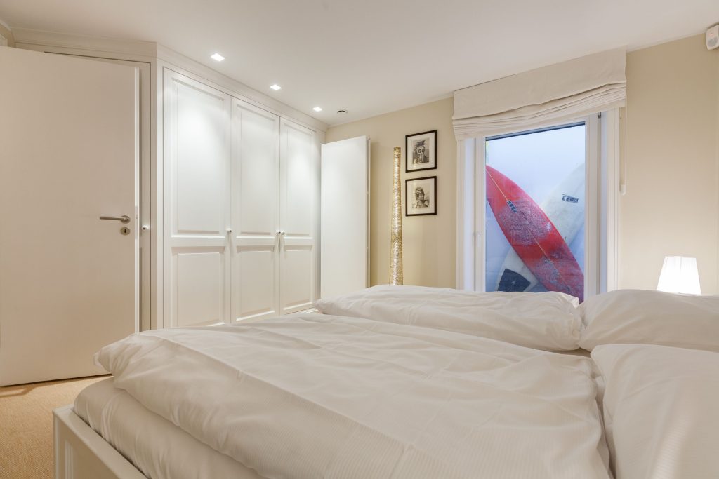 Schlafzimmer in Ferienwohnung Wenningstedt