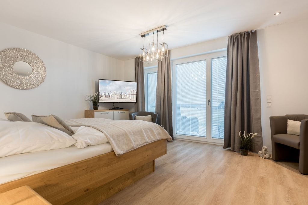 Schlafzimmer in Ferienwohnung Wenningstedt