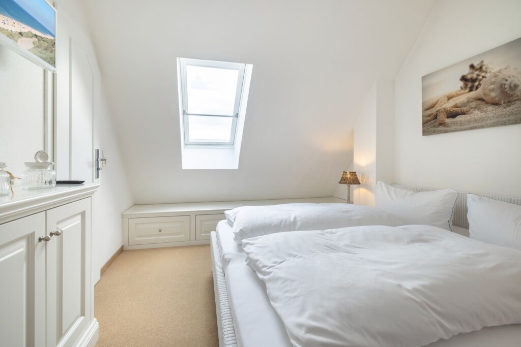 Schlafzimmer in Ferienwohnung Wenningstedt