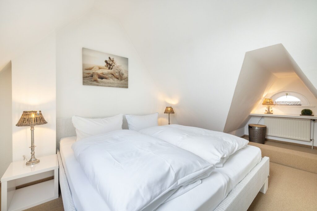 Schlafzimmer in Ferienwohnung Wenningstedt