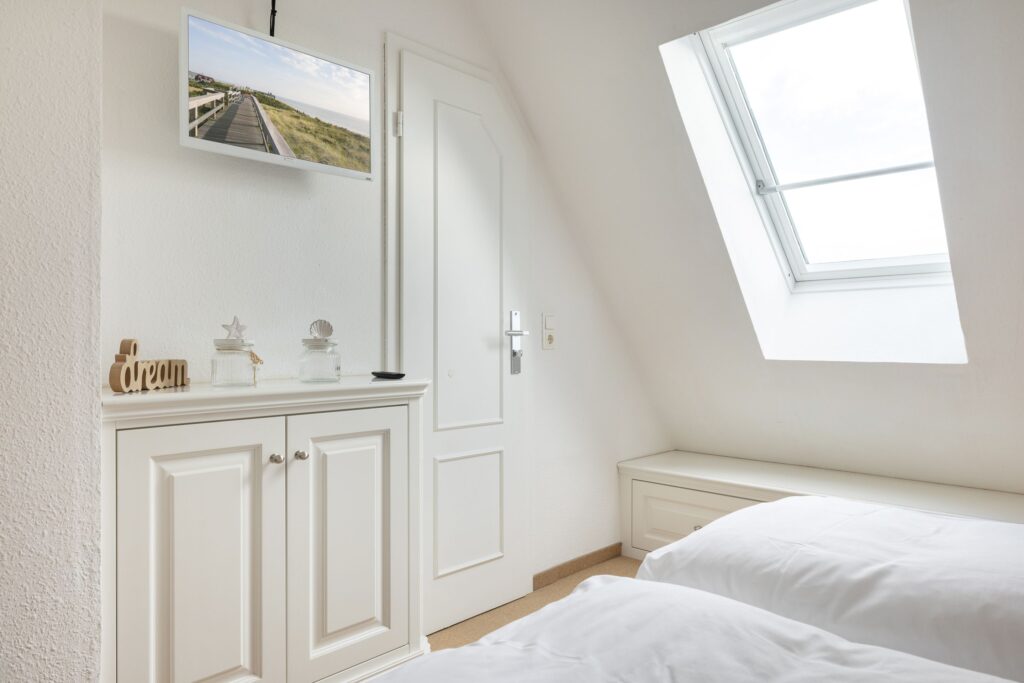 Schlafzimmer in Ferienwohnung Wenningstedt