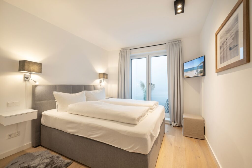 Schlafzimmer in Ferienwohnung Wenningstedt