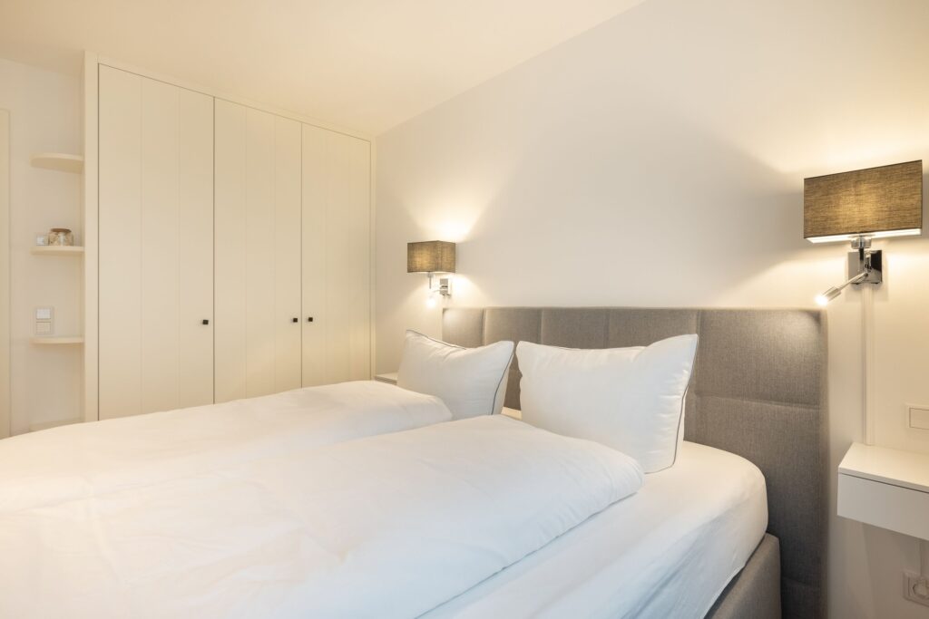 Schlafzimmer in Ferienwohnung Wenningstedt